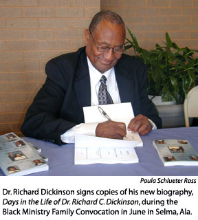 Dickinson signs book