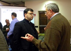 The Rev. Dr. Allan Buckman, right, chairman of Christian Friends of New Americans, talks with the Rev. Ted Krey, regional director for Latin America and the Caribbean with the Synod's Office of International Mission, during the annual conference of the Association of Lutheran Mission Agencies. (LCMS Communications/Paula Schlueter Ross)