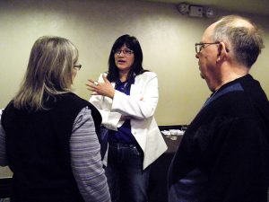 Patricia Main, center, co-director of campus ministry at Haskell Indian Nations University in Lawrence, Kan., talks with attendees after leading a session at the Association of Lutheran Mission Agencies conference. So many of the students she serves "have a story," Main said, and "just want somebody to listen to them." (LCMS Communications/Paula Schlueter Ross)