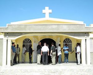 Haitians and representatives of the Synod and Concordia Theological Seminary, Fort Wayne, Ind., gather for the Jan. 14, 2012, dedication of the new Evangelical Lutheran Church of Haiti seminary headquarters in Leogane. (LCMS Communications/Al Dowbnia)