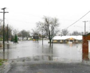 Floodwaters surround buildings in Roanoke, Ill., after the rain-swollen Panther Creek overflowed on April 17, 2013. (Trinity Lutheran Church/Julie Ludeman)