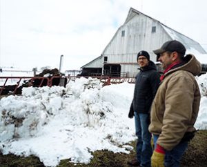 First-year seminarian Aaron Spratt, left, and Don Schlesselman discuss agribusiness during a visit to the Schlesselman family farm near Concordia, Mo., as part of LCMS Rural and Small Town Mission’s first “Rural Immersion” event. (Amy Gerdts)