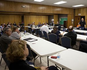 Pastor Mark Bersche leads a meeting at St. John's Lutheran Church in Moore, Okla., to discuss how to help tornado victims. (Dan Gill)