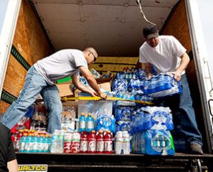 Workers unload donations of drinking water and other supplies at St. John's Lutheran Church in Moore, Okla., on May 24, 2013. (Dan Gill)