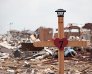 A cross marks the crumbled remains of Plaza Towers Elementary School in Moore, Okla., where seven children were killed. (Dan Gill)