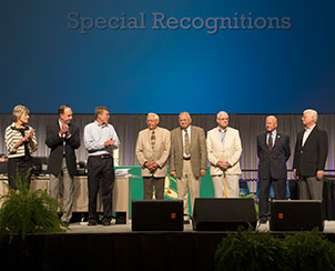 Newly elected members of the Synod Board of Directors, left, join the convention in thanking outgoing members, at right, for their service to the church. (LCMS Communications)