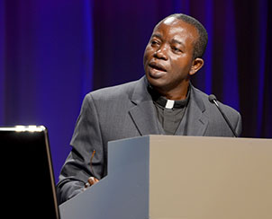 The Rev. Amos Bolay, president and bishop of the Evangelical Lutheran Church of Liberia, delivers greetings and an essay to convention delegates and participants.