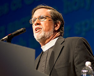 The Rev. William Cwirla delivers the first of four convention essays, “Baptized for this Moment,” Sunday at the 65th Regular Convention.