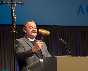 LCMS President Rev. Dr. Matthew C. Harrison describes the historic gavel before using it to formally open the first business session of the 65th Regular Convention of The Lutheran Church—Missouri Synod on Sunday, July 21. The intricately carved gavel bears the likenesses of Martin Luther and C.F.W. Walther, the Synod's first president, and has been used at every Synod convention since 1911. (LCMS Communications)