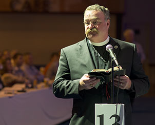 Synod President Rev. Dr. Matthew C. Harrison leaves the convention dais to speak from the floor.