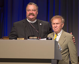 The Rev. Dr. Matthew C. Harrison thanks outgoing LCMS Third Vice-President Rev. Dr. Paul L. Maier for his many years of service to the church. (LCMS Communications)