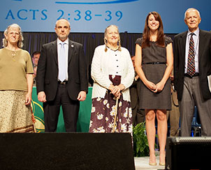 Recognized with a standing ovation by the convention on July 22 were, from left, Alice Paul, Darin Storkson, Dr. Alice Brauer, Katie Lane and the Rev. Dr. Gordon Beck. (LCMS Communications)