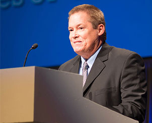 The Rev. Frederick M. Reinhardt, former missionary to Togo, brings greetings to the convention on behalf of the leaders of the Lutheran Church of Togo. (LCMS Communications)