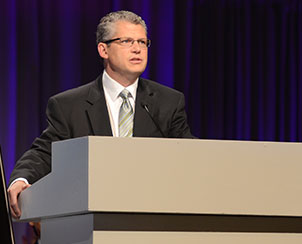 The Rev. Dr. James Baneck, chairman of the 2013 LCMS convention floor committee on Witness, gives an overview of some of the resolutions that will be brought before the convention. (LCMS Communications)