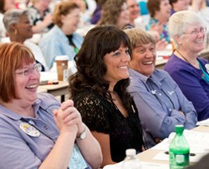 Lutheran Women's Missionary League members share a light moment during the convention. During business sessions, delegates adopted a record mission-grant goal of $1.83 million. (Lutheran Women's Missionary League/BBM Photo)