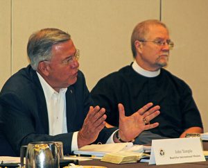 The Rev. John Temple, a member of the Board for International Mission, makes a point during the board meeting. At right is the Rev. John Fale, associate executive director of LCMS Mercy Operations. (Juan Gonzalez)