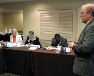 The Rev. John A. Fale, associate executive director of LCMS Mercy Operations, presents a new policy on extending calls to those endorsed for Specialized Pastoral Ministry (SPM) to the LCMS Board for National Mission at its meeting Sept. 12-13 in St. Louis. The board will now serve as the calling agency for SPM pastors. (LCMS Communications/Melanie Ave)