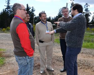 Pastor Fabrizio Perez, right, describes the disaster-relief work he and others in the Confessional Lutheran Church of Chile did in this now-empty refugee camp in Constitución, Chile, following the 2010 earthquake and tsunami. With funding from the LCMS, Lutherans in Chile provided emergency housing for some 1,000 displaced people. Listening, from left, are Ezeguielton Rieder of the Evangelical Lutheran Church of Paraguay; the Rev. Elias Lozano, president of the Lutheran Church of Venezuela; the Rev. Christian Hoffmann, president of the Lutheran Church of Uruguay; and the Rev. Reubens Ogg, secretary for the Evangelical Lutheran Church of Brazil. All were participants at the disaster-response conference in Santiago, Chile. (LCMS Communications/Pamela J. Nielsen)