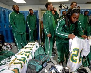 Concordia College Alabama's Khalil Osborn unpacks his jersey Sept. 26, 2013, in the locker room at Demopolis High School in Demopolis, Ala., as the Hornets prepare for their game against the University of West Alabama. Adidas donated jerseys, pants, shoes and other equipment to the Selma, Ala., Hornets who lost everything in a Sept. 21, 2013, bus fire. (AL.com/Julie Bennett)