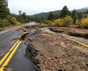 A yellow gas line lies atop the mud and gravel of a flood-destroyed road in Estes Park, Colo. LCMS Disaster Response and the Rocky Mountain District are working to help congregations respond to the needs of local flood victims. (LCMS Disaster Response/Ross Johnson)