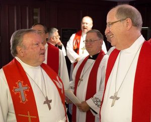 LCMS leaders visit in the narthex of the chapel at Concordia Seminary, St. Louis, before processing in the Sept. 14 installation service for the LCMS president and others elected this summer to serve the Synod.  In the foreground, from left, are LCMS Oklahoma District President Rev. Barrie E. Henke and Iowa District West President Rev. Dr. Paul G. Sieveking. (LCMS Communications/Michael Schuermann)