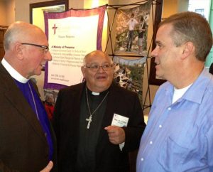 From left, the Rev. Dr. David Benke, president of the LCMS Atlantic District; the Rev. Dr. Carlos Hernandez, director of LCMS Church and Community Engagement; and the Rev. Mark Mueller, pastor at Bethlehem Lutheran Church in Delmar, N.Y., talk during the 5th LCMS National Disaster Response Conference in St. Louis. Presentations included one by Benke on the district’s role in natural disasters. (LCMS Communications/Al Dowbnia)