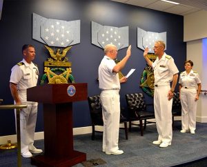 Rear Admiral Mark Tidd, chief of chaplains (left, center), administers the oath for Rear Admiral Daniel L. Gard. (LCMS Communications)