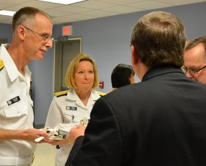 From left, Rear Admiral Rev. Daniel L. Gard; Vice Admiral Robin Braun, an LCMS member; LCMS First Vice-President Rev. Dr. Herbert C. Mueller Jr.; and Concordia Theological Seminary Dean of Students Rev. Tom Zimmerman share stories following Gard's promotion to Rear Admiral. (LCMS Communications)