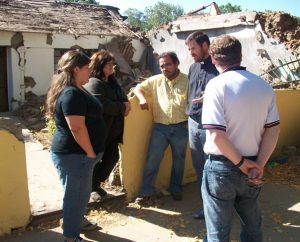 Three pastors in the ILC-Chile deliver messages of comfort to two women after the Feb. 27, 2013, earthquake. From left, the pastors are the Rev. Alejandro Lopez; ILC-Chile President Rev. Cristian Rautenberg; and the Rev. Dr. Carlos Schumann, former president of the ILC-Chile. (LCMS Communications)