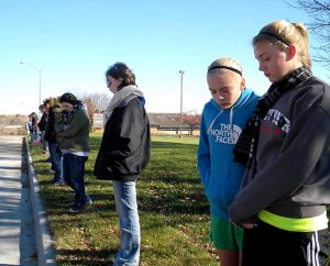 Youth attending the Lutherans For Life (LFL) national conference in Urbandale, Iowa, pray silently outside the local Planned Parenthood facility on Nov. 8. The group included members of two campus pro-life organizations — Bulldogs for the Unborn at Concordia University Nebraska, Seward, and Students for Life at Concordia University Wisconsin, Mequon — as well as a Council Bluffs, Iowa, high school. (LCMS Communications/Paula Schlueter Ross)