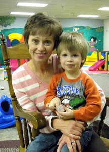 New Lutherans For Life (LFL) President Lynette Auch poses with her grandson Isaac in the childcare facility at Gloria Dei Lutheran Church in Urbandale, Iowa. The congregation hosted LFL's 2013 national conference. (LCMS Communications/Paula Schlueter Ross)