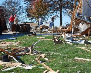 The Rev. Timothy Mueller (in red at left), pastor of St. John's Lutheran Church in New Minden, Ill., works with volunteers on Nov. 18 to clean up his tornado-damaged parsonage. (Bill Engfehr)