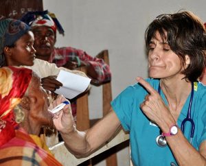 Mercy Medical Team (MMT) member Meredith Davis teaches a patient how to have her temperature taken during an MMT trip to Madagascar in March 2013. The team treated 1,321 patients and filled 4,000 prescriptions there. Five trips are planned for 2014. (Sharon Thomas)