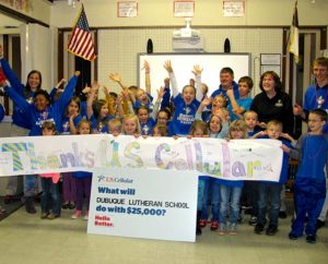 Students and staff of Dubuque Lutheran School in Dubuque, Iowa, celebrate winning $25,000 for the school in the U.S. Cellular Calling All Communities contest Dec. 10. The school has 35 students in kindergarten through fifth grade. (Linda Nudd)