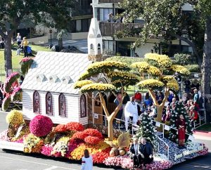 LCMS President Rev. Dr. Matthew C. Harrison and his wife, Kathy, lower right, ride on the Lutheran Hour Ministries Rose Parade float Jan. 1 in Pasadena, Calif. The float's "Jesus Welcomes All" theme depicted people of various nationalities being welcomed into a church with open doors, illustrating that "all tribes and nations would come to know Christ as Lord." (Lutheran Hour Ministries)