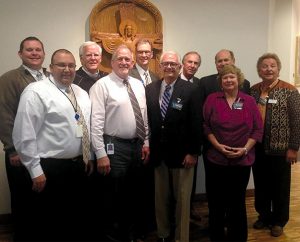 Attending the meeting of four worker-wellness groups Nov. 18 are, from left, front row: the Rev. Bart Day, the Rev. David Muench, Dr. John D. Eckrich and Dr. Patti Brunold; back row: the Rev. Dr. Justin Hannemann, the Rev. Dr. Harold Senkbeil, the Rev. Dr. Darrell Zimmerman, Phil Bayes, the Rev. Dr. David Ludwig and Dave Anderson. (LCMS Office of National Mission)