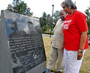 The Rev. Dr. Bryant E. Clancy Jr. of St. Louis and Dr. Cynthia Roddy of Catawba, S.C., read a marker in Greensboro, N.C., at the site for the campus of the Synod's Immanuel Lutheran College, of which both are graduates. That site now is occupied by North Carolina A&T University, where the 2012 LCMS Black Ministry Convocation took place. (LCMS Communications/Joe Isenhower Jr.)