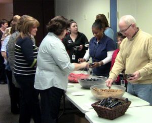 Concordia Plan Services employees celebrate being named a “Healthiest 100” workplace with a yogurt bar, fresh fruit and granola in their offices at the LCMS International Center in St. Louis. (CPS/Matt Madden)