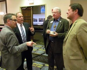 Ross Stroh, far left, the Synod’s new executive director of Accounting, meets LCMS Board of Directors members Jim Carter and Ed Everts, third and fourth from left, during a break in the Board’s Feb. 14 meeting. To Stroh’s left is Synod Chief Administrative Officer Ron Schultz. In the background is LCMS Secretary Rev. Dr. Raymond Hartwig. (LCMS Communications/Joe Isenhower Jr.)