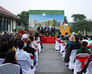 Claire Pierangelo (at podium), deputy chief of mission for the U.S. Embassy in Hanoi and parent of a Concordia International School Hanoi (CISH) student, addresses guests at the March 26 celebration for the start of the first phase of construction on the school's permanent campus in north Hanoi, Vietnam. From left are: Steve Winkelman, CISH head of school; Gregg A. Pinick, Concordia International School Shanghai head of school and a member of the CISH board of directors; and Son Jin Young, project director for Van Tri Development. (J.P. Cima)
