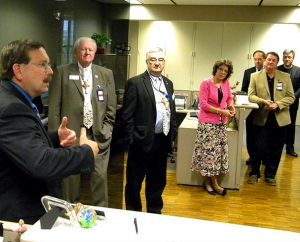 Synod First Vice-President Rev. Dr. Herbert C. Mueller Jr. (left) thanks the LCMS Board of Directors and staff gathered during the Board’s May 16-17 meeting to wish him “happy birthday” on the first day of the meeting. Mueller also spoke of his upcoming open-heart surgery the following week that was considered to be successful. Pictured, from left, are Board member James Carter, LCMS Chief Financial Officer Jerald C. Wulf, Board members Kathy Schulz, Kurt Senske and Ed Everts, and the Rev. Dr. Jon Vieker, senior assistant to the Synod president. (LCMS Communications/Joe Isenhower Jr.)