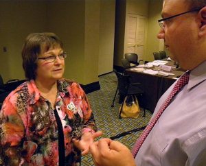 Lutheran Women’s Missionary League President Kay Kreklau and the Rev. Bart Day, executive director of the LCMS Office of National Mission, visit during a break in the May 30-31 Board for National Mission meeting in St. Louis. (LCMS/Joe Isenhower Jr.)