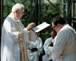 The Rev. Dr. Ray Mirly, president of the LCMS Missouri District, installs the Rev. Dr. Paul A. Philp during a June 18 service at the LCMS International Center in St. Louis. Philp is the new director of Institutional Research and Integrity for the Concordia University System. (LCMS Communications/Frank Kohn)