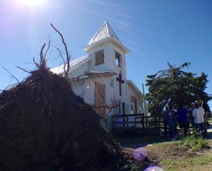 A June 18, 2014, tornado uprooted a tree and damaged Zion Lutheran Church in Wessington Springs, S.D. The storm also severely damaged the church’s unoccupied parsonage and the homes of two Zion members. (LCMS Communications/Al Dowbnia)