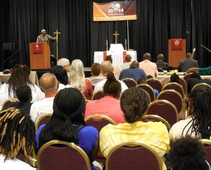 The Rev. Dr. Victor Belton leads the convocation's opening devotion on July 10. The power of Jesus Christ "is in you," he told worshipers. "Confess with your mouth" what you "believe in your heart" — that "Christ died for you … and for all." (LCMS/Paula Schlueter Ross)