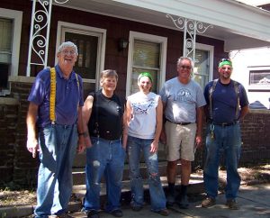 Helping Hand accomplishments are more about newly built relationships with people like Fort Wayne homeowner Tim Jeffries, second from left, than about newly repaired houses. Conversations with Laborers — who include, from left, Tim Brettin, Heidi Wilkinson, Gary Trombley and Steve Reif — prompted Jeffries to attend worship at Emmanuel Lutheran Church. (Lutheran Church Extension Fund)
