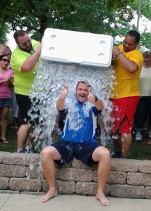 Jim Sanft, president and CEO of Concordia Plan Services (CPS), takes the "ALS Ice Bucket Challenge" during a CPS employee picnic Aug. 20 at Kirkwood Park. Pouring the water are CPS employees Jason Williams, left, and Curtis Wooten. CPS plans to donate employee pledges of $3,155.52 to an ALS organization aligned with LCMS Life Ministries. (Concordia Plan Services/Diane Mottert)