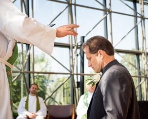 The Rev. Dan McMiller is installed Aug. 14 as director of recruitment for the LCMS Office of International Mission by Synod President Rev. Dr. Matthew C. Harrison. (LCMS/Erik M. Lunsford)