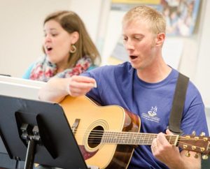 The Rev. Andrew Ratcliffe, pastor at St. John Lutheran Church, Seward, Neb., leads a July 29 institute workshop on the liturgical use of the guitar. (LCMS/Erik M. Lunsford)