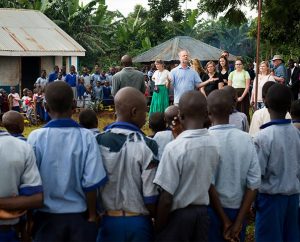 The Rev. Dr. John Juedes, pastor of Messiah Lutheran Church in Highland, Calif., and part of 14-member LCMS Mercy Medical team working in Kenya during June, 1014, addresses Kenyan school children at the site of a one-week clinic. During its most recent meeting, the LCMS Board for International Mission discussed the benefits of and ways to maximize short-term mission teams. (LCMS/Erik M. Lunsford)